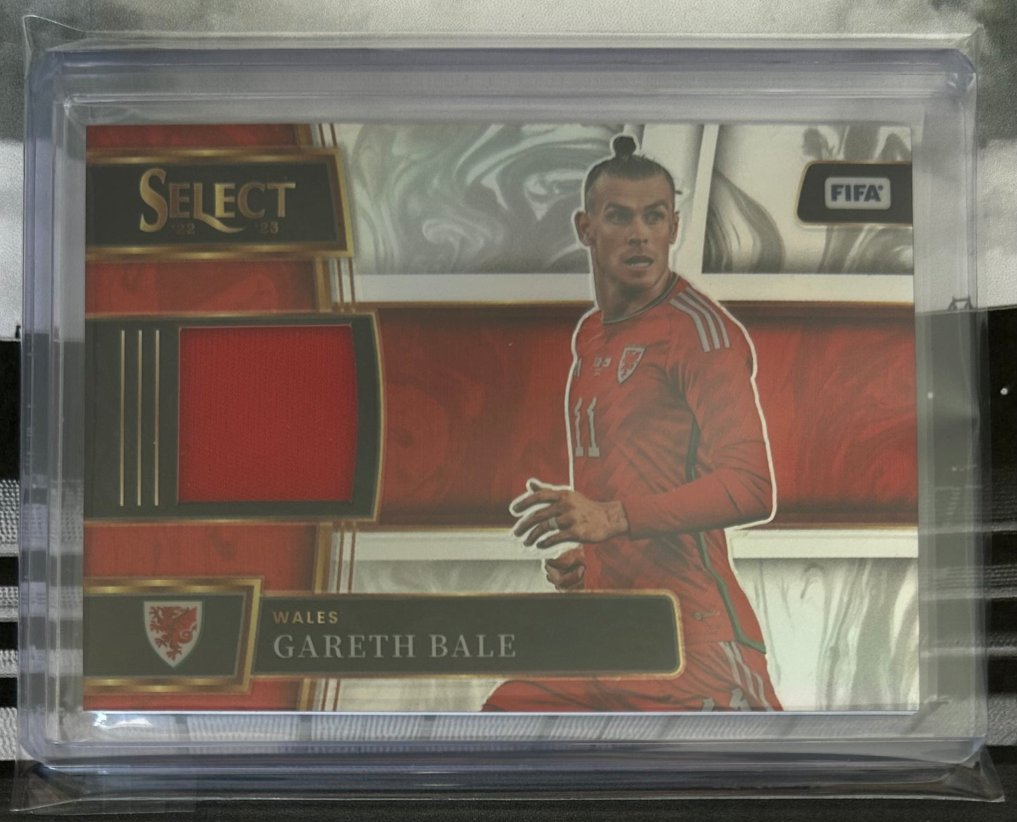 2022-23 Panini Select FIFA Soccer - GARETH BALE (WALES) Player-Worn Patch #SM-GBE